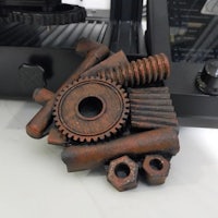 a 3d printer with gears and nuts on it