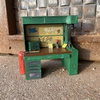 a toy workbench with tools on it