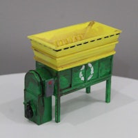 a model of a recycling bin on a table